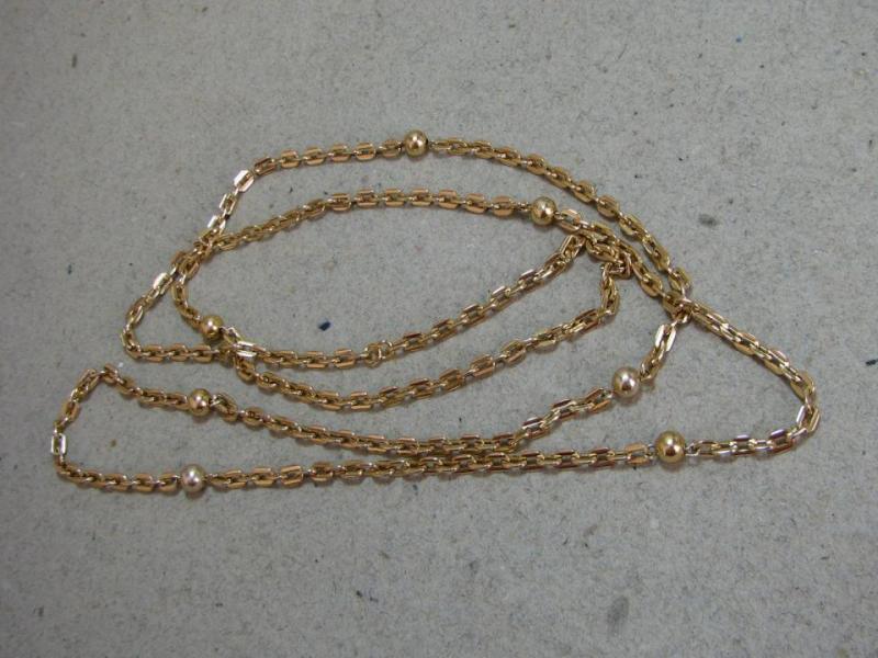 En Krona Auktion -  Halsband med 7 guldfärgade pärlor