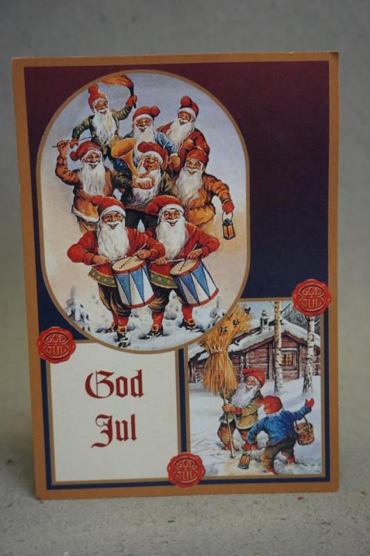 Julkort - Glada  Tomtar av Erik Forsman - med ett ostämplat julfrimärke 