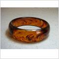 Armband - B�rnstensf�rgat  med skiftningar av glitter och svart