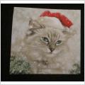 servett med en söt katt med tomteluva