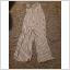 Randig vit jumpsuit med vida ben st 38